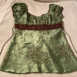 Polyester blouse in green in medium. Tags are missing. Not sure what brand.